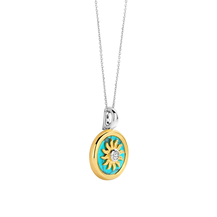 SILVER GOLD PLATED SUN HANDSET A CAPTIVATING TURQUOISE BACKDROP